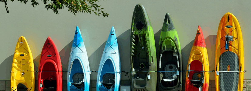 a row of kayaks bought with kayak financing