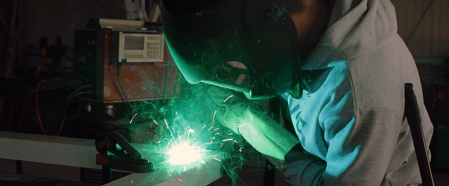 A man using a welder after financing.