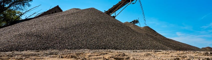 A pile of gravel that will be hauled with a dump trailer. 