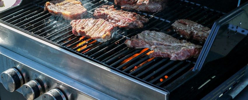 Cooking on a gas grill purchased with financing.