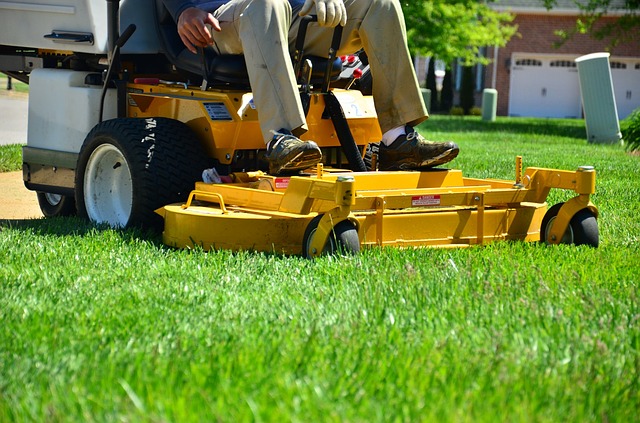 Lanscaper running a zero turn mower.