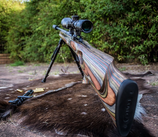 Hunting rifle with a scope.
