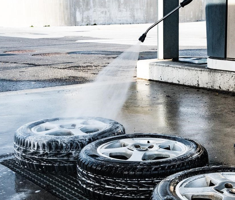 Pressure washing a tire.