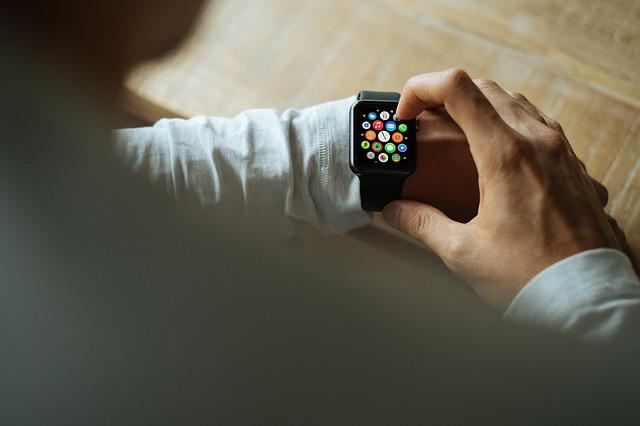 Wearing a smart watch on a wrist.