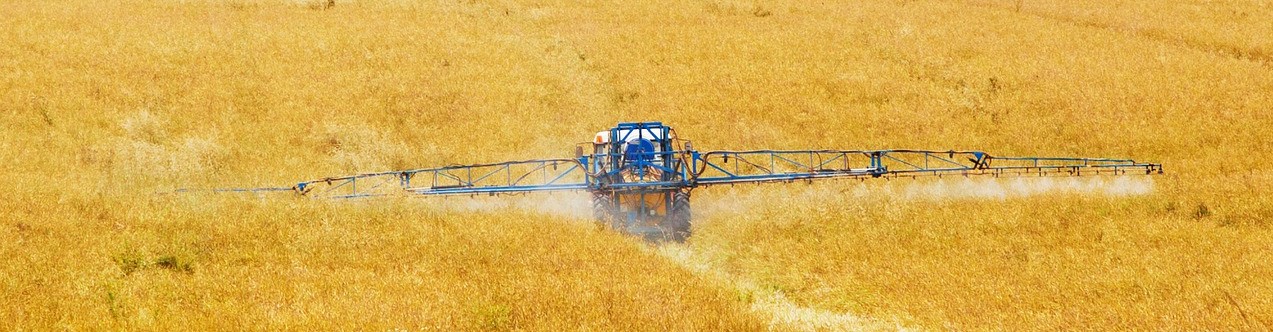 Using farm equipment purchased with a loan.