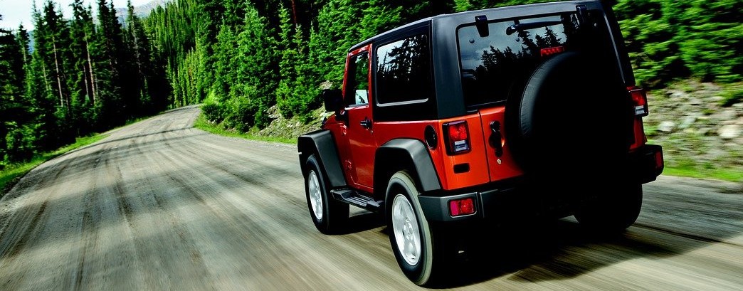 Wrangler driving on a road.